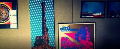 Wall with a mandala, a desert rock print and a psychedelic Jimi Hendrix poster